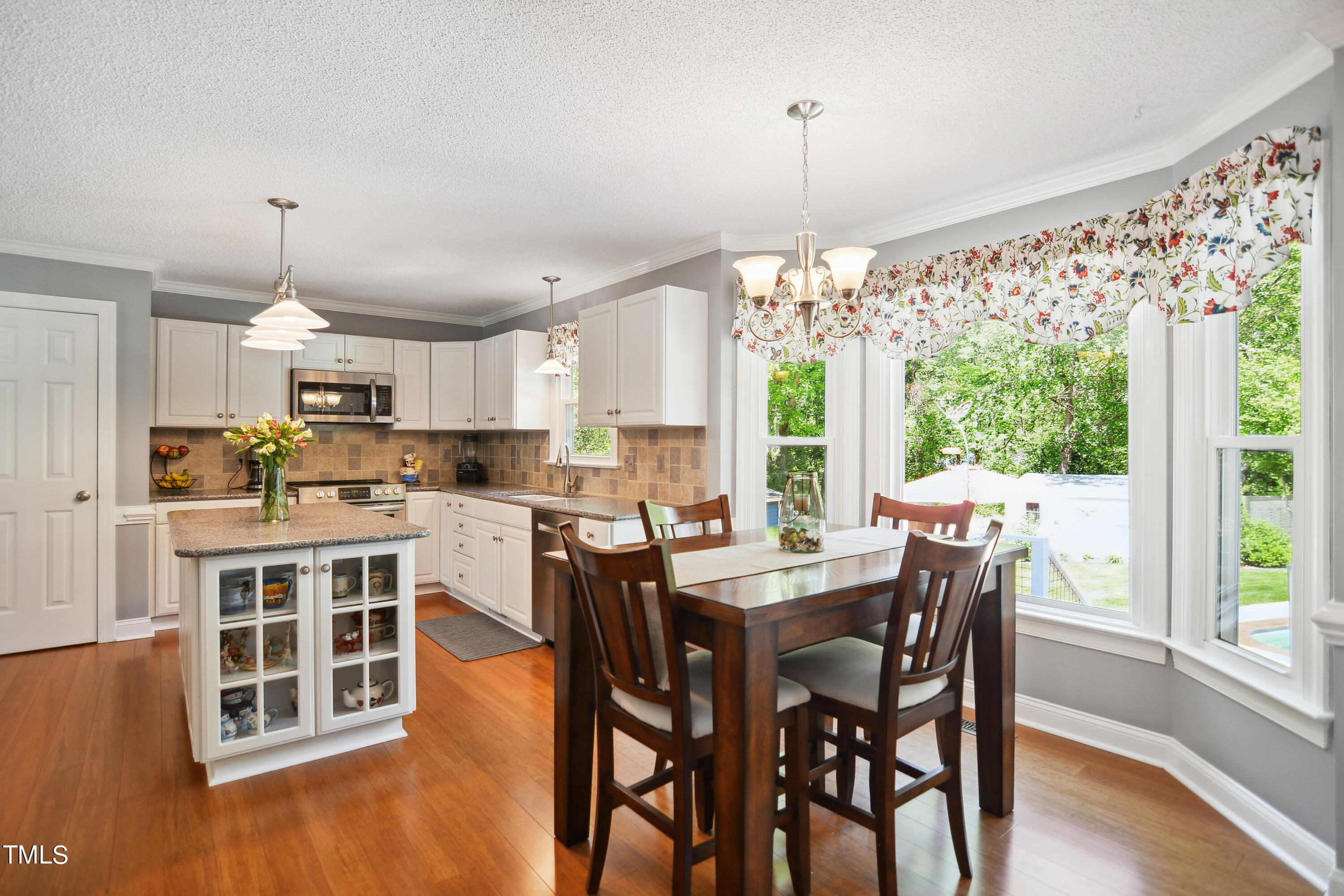 300 Foley Drive Garner, NC 27529 - Photo 9 of 29 a view of a dining room with furniture window and wooden floor