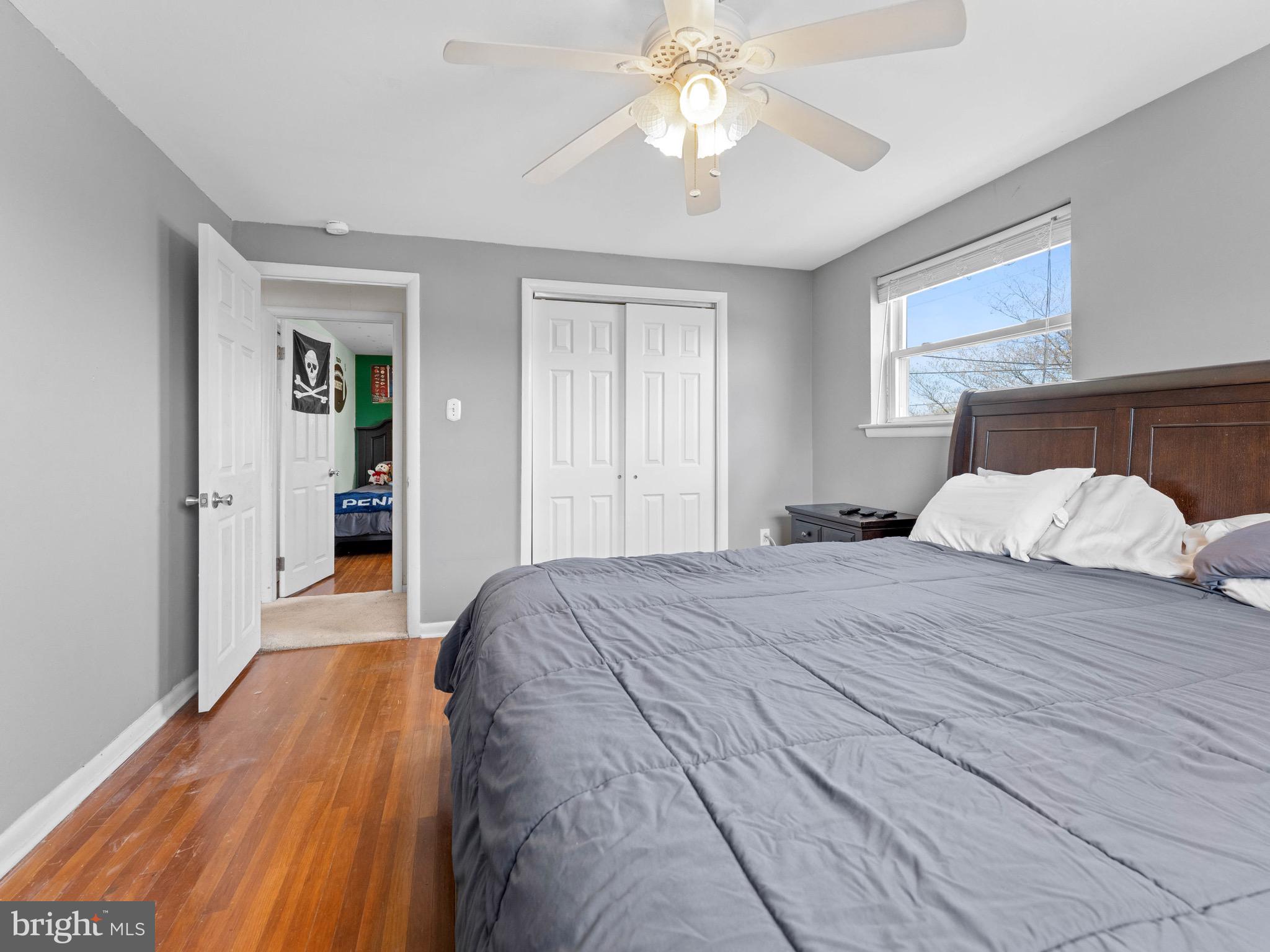 2685 Weir Road Aston, PA 19014 - Photo 15 of 27 a bedroom with a large bed and a chandelier