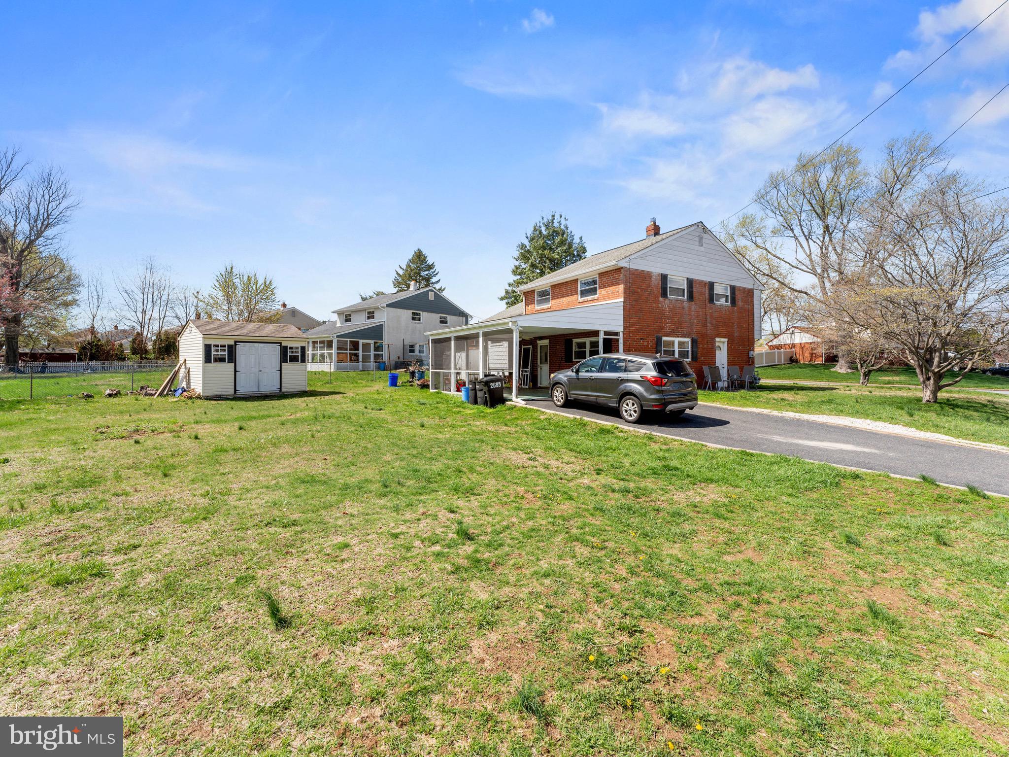 2685 Weir Road Aston, PA 19014 - Photo 27 of 27 a view of a house with a big yard and large trees