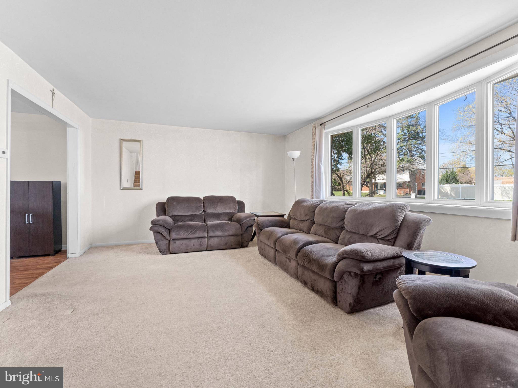 2685 Weir Road Aston, PA 19014 - Photo 4 of 27 a living room with furniture a large window and a couch
