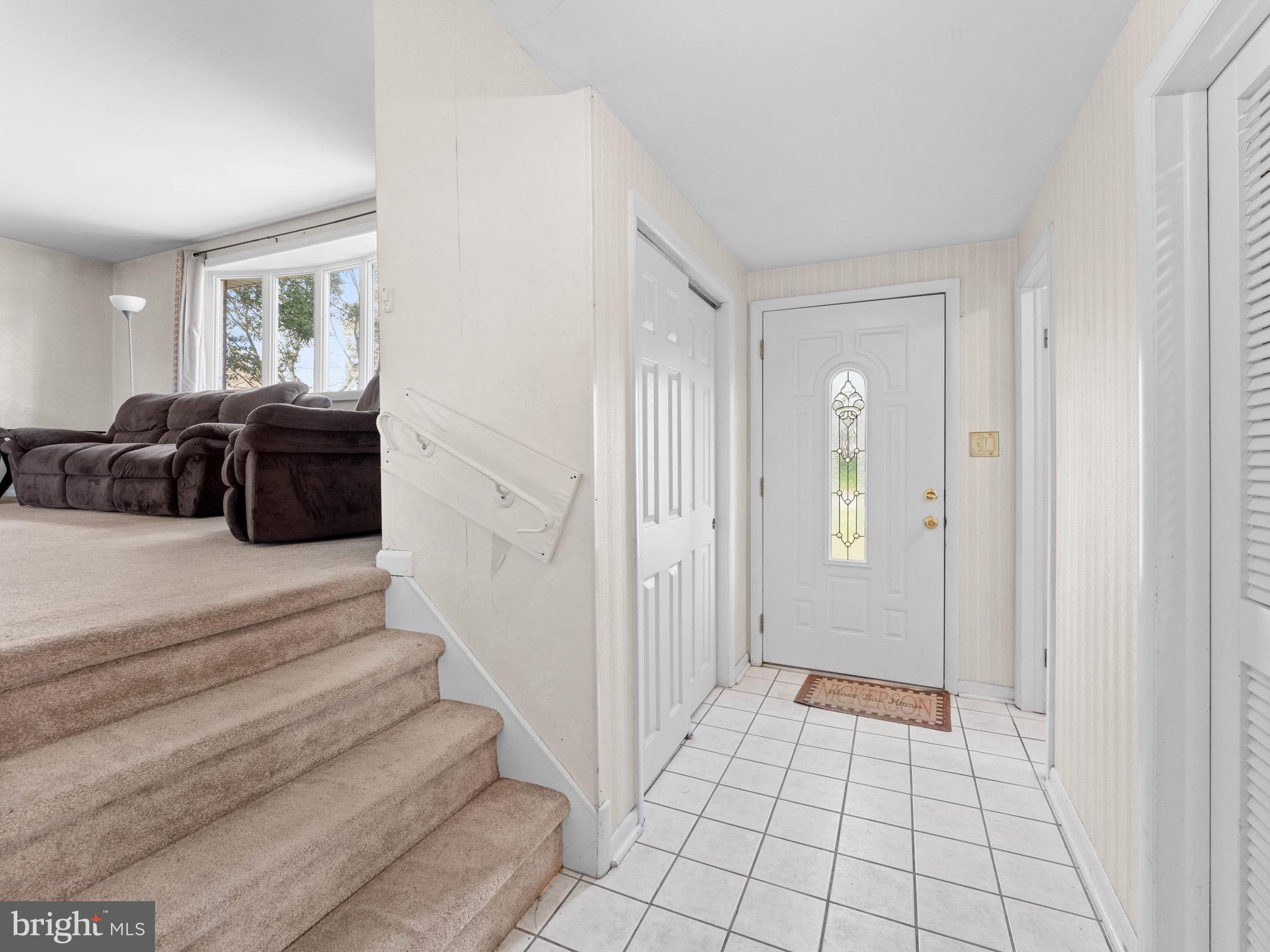 2685 Weir Road Aston, PA 19014 - Photo 6 of 27 a spacious bedroom with a bed and a couch