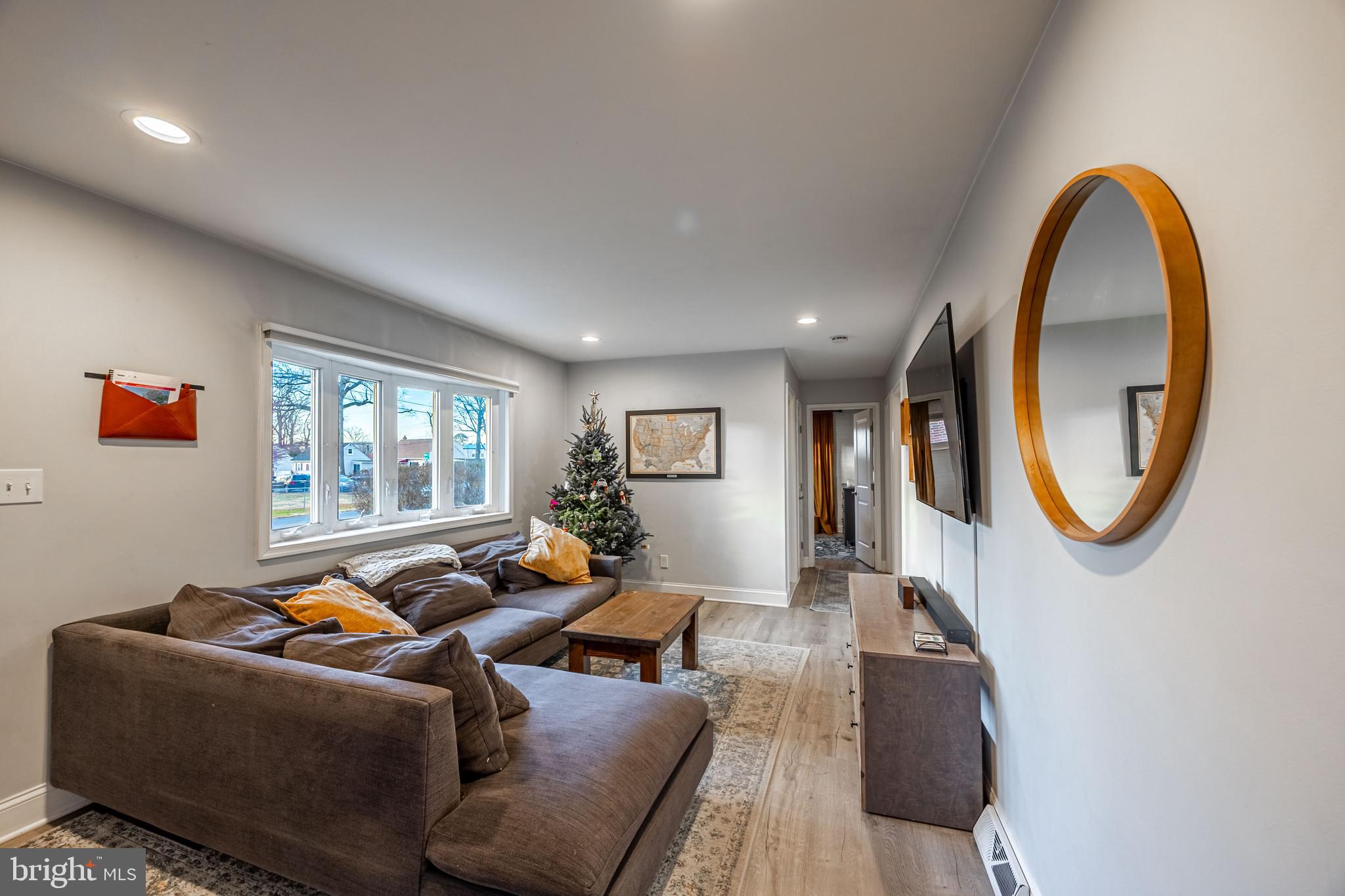 1001 Nancy Road Glen Burnie, MD 21061 - Photo 12 of 30 a living room with furniture a mirror and a window