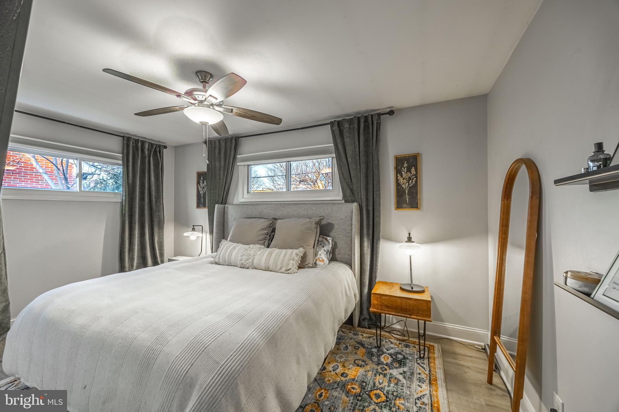 1001 Nancy Road Glen Burnie, MD 21061 - Photo 16 of 30 a bedroom with a large bed and a chandelier