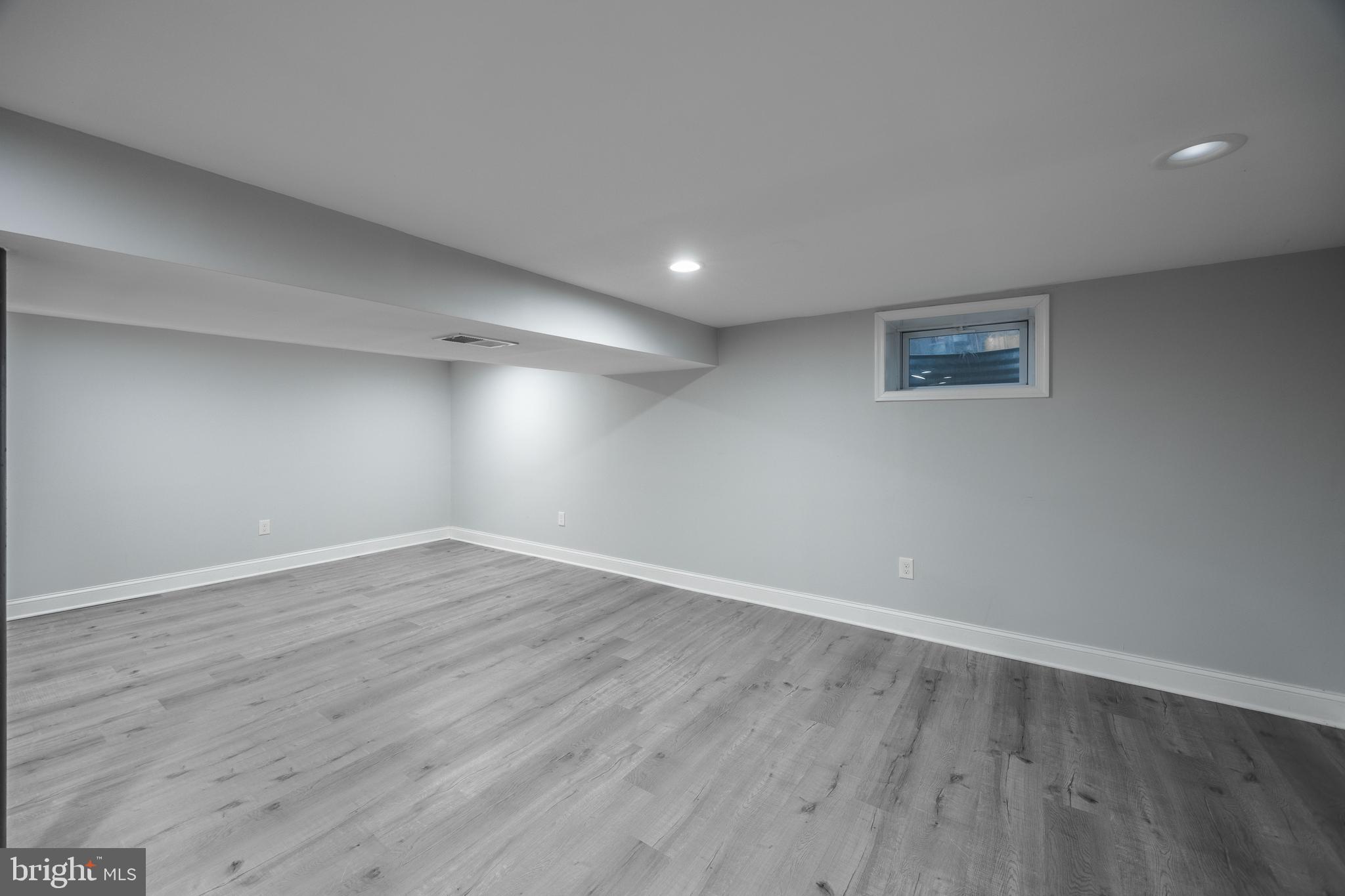 1001 Nancy Road Glen Burnie, MD 21061 - Photo 28 of 30 a view of an empty room with wooden floor