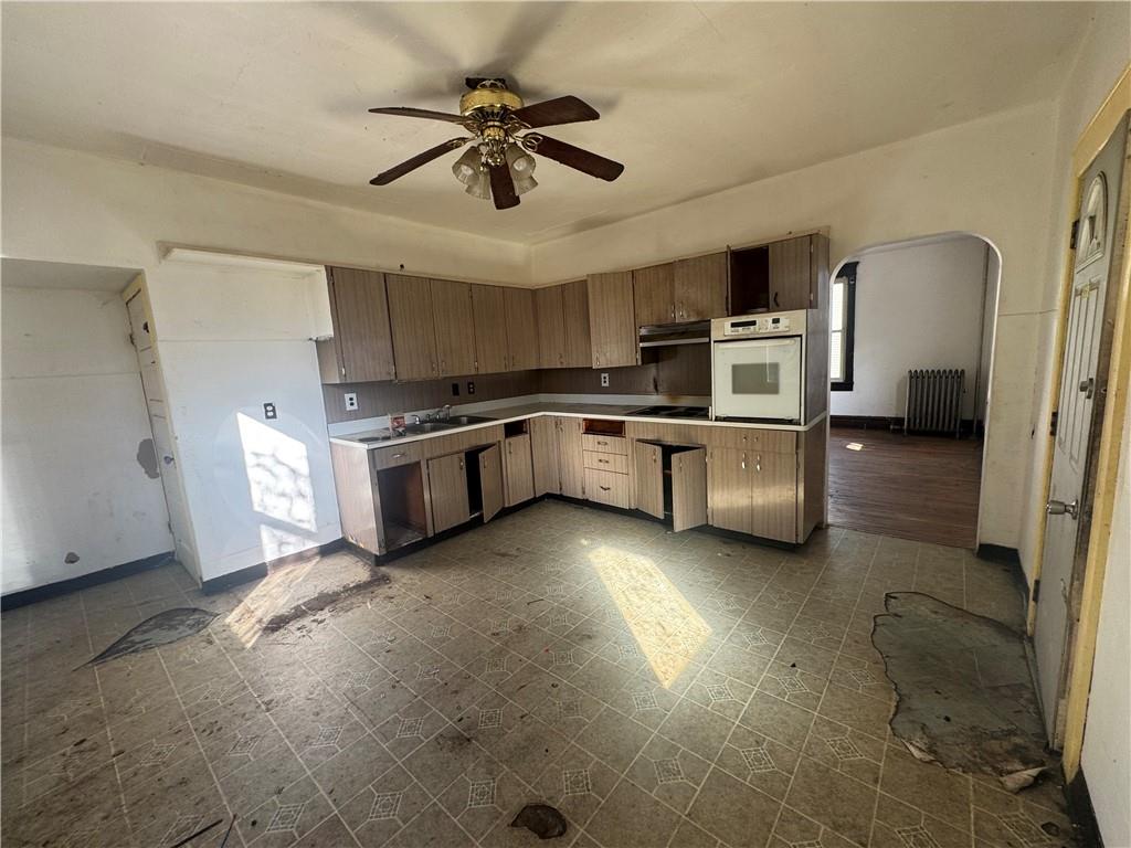 431 1st Street Allison, PA 15413 - Photo 6 of 15 a kitchen with stainless steel appliances granite countertop a sink and a stove