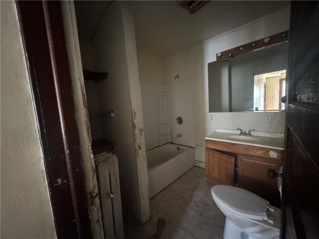 431 1st Street Allison, PA 15413 - Photo 7 of 15 a bathroom with a granite countertop toilet a sink and bathtub