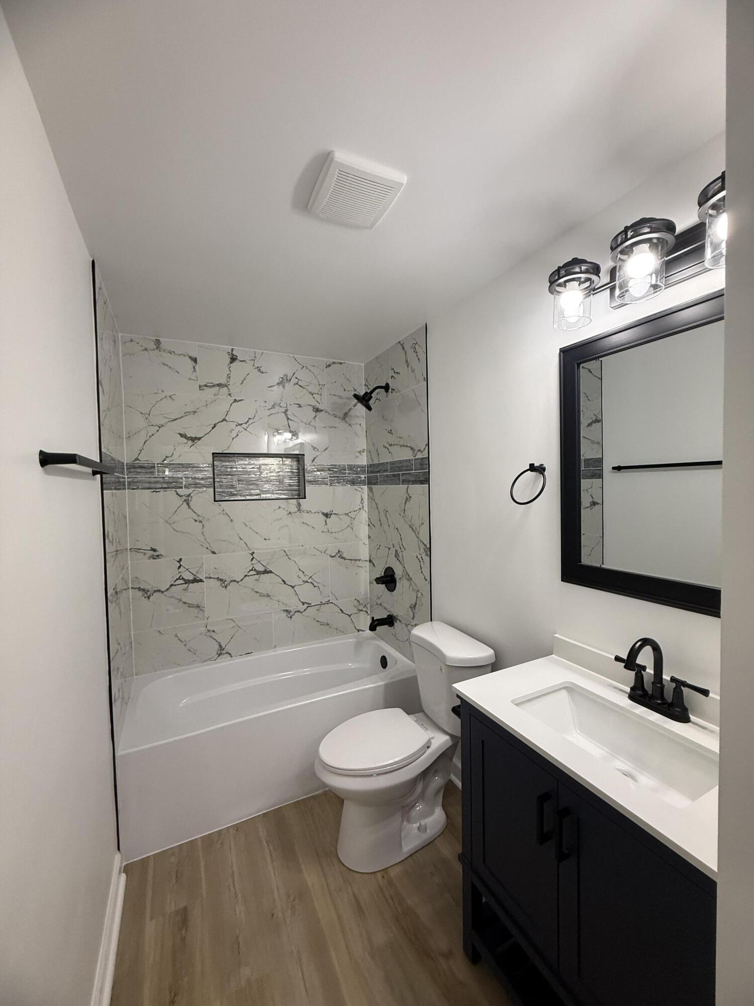 408 Cherry Hill Road Dyer, IN 46311 - Photo 7 of 31 a bathroom with a sink a toilet and shower