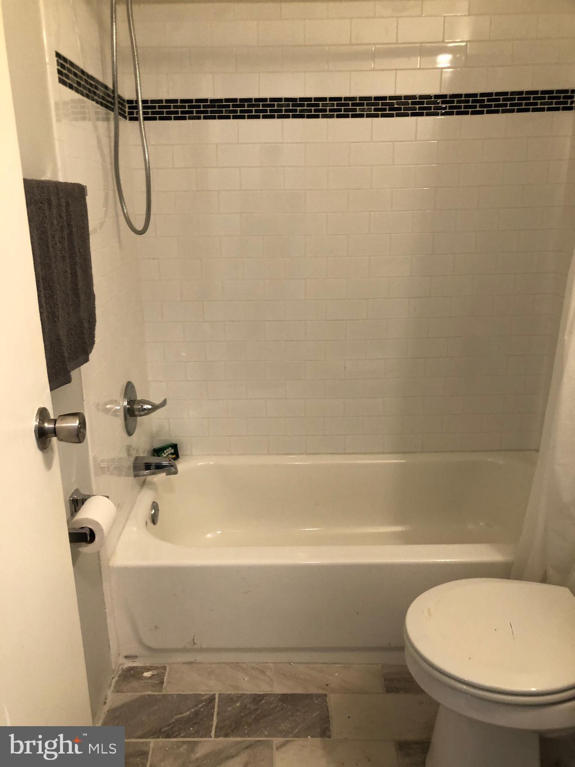 8726 Marsden Street Philadelphia, PA 19136 - Photo 12 of 24 a bathroom with a shower and a toilet