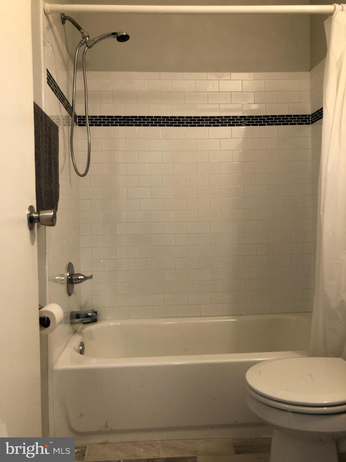 8726 Marsden Street Philadelphia, PA 19136 - Photo 13 of 24 a bathroom with a toilet and a shower