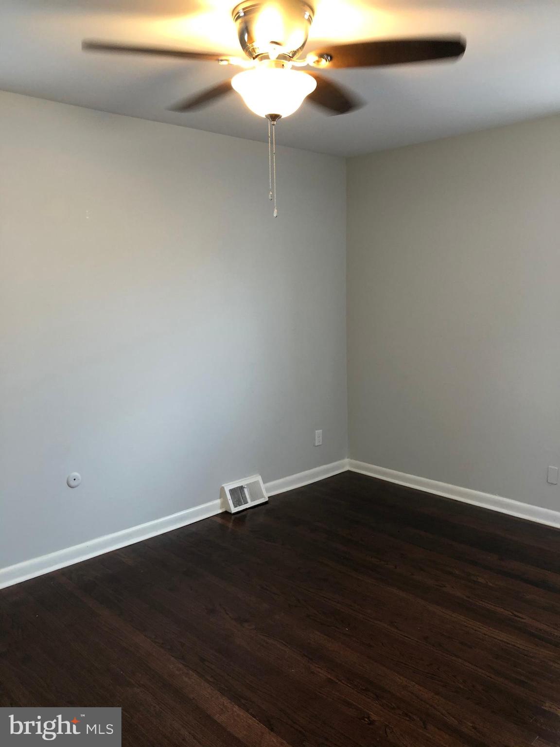 8726 Marsden Street Philadelphia, PA 19136 - Photo 15 of 24 a view of a small space with wooden floor and fan