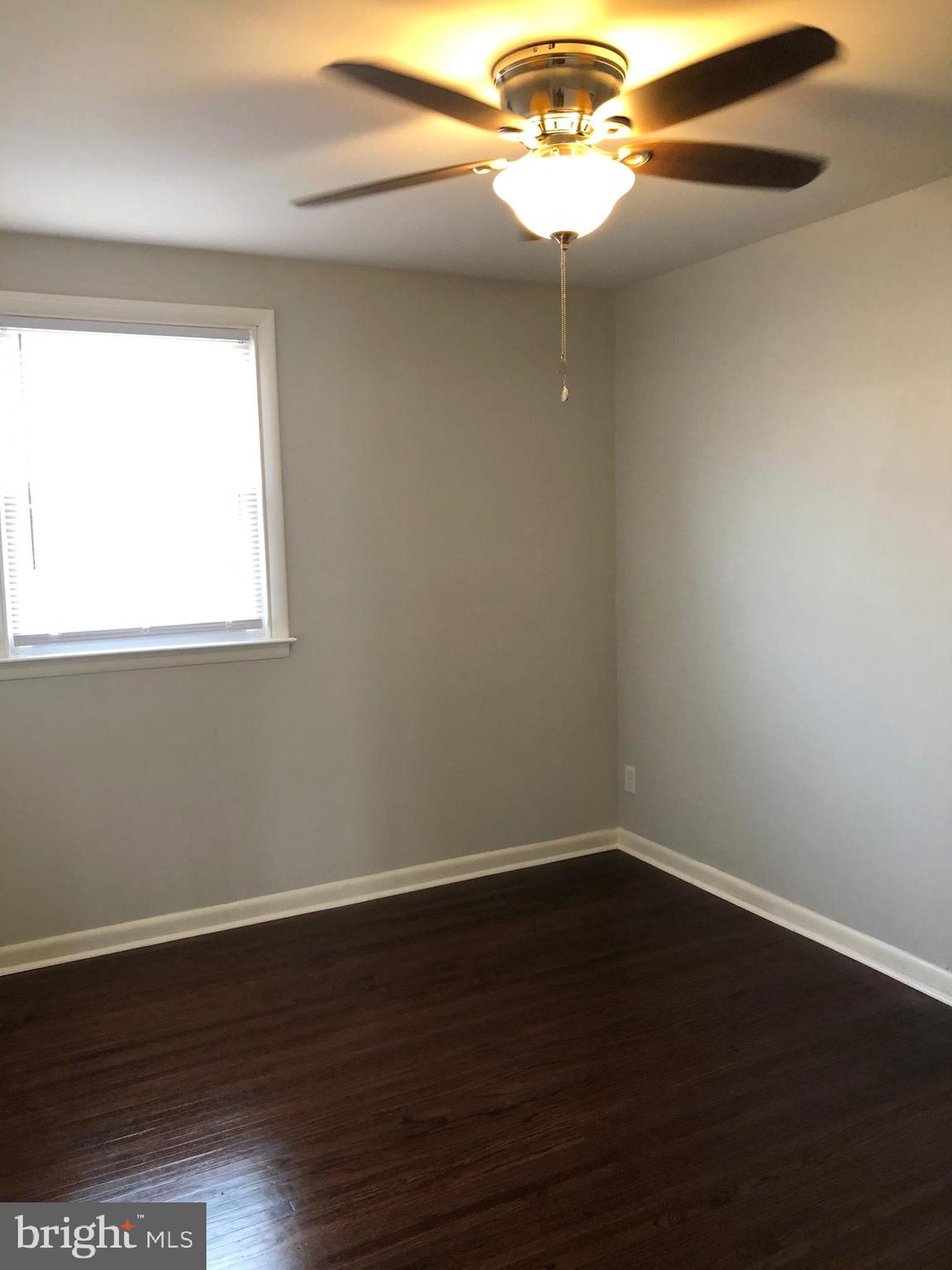 8726 Marsden Street Philadelphia, PA 19136 - Photo 17 of 24 a view of a small space with wooden floor and a window