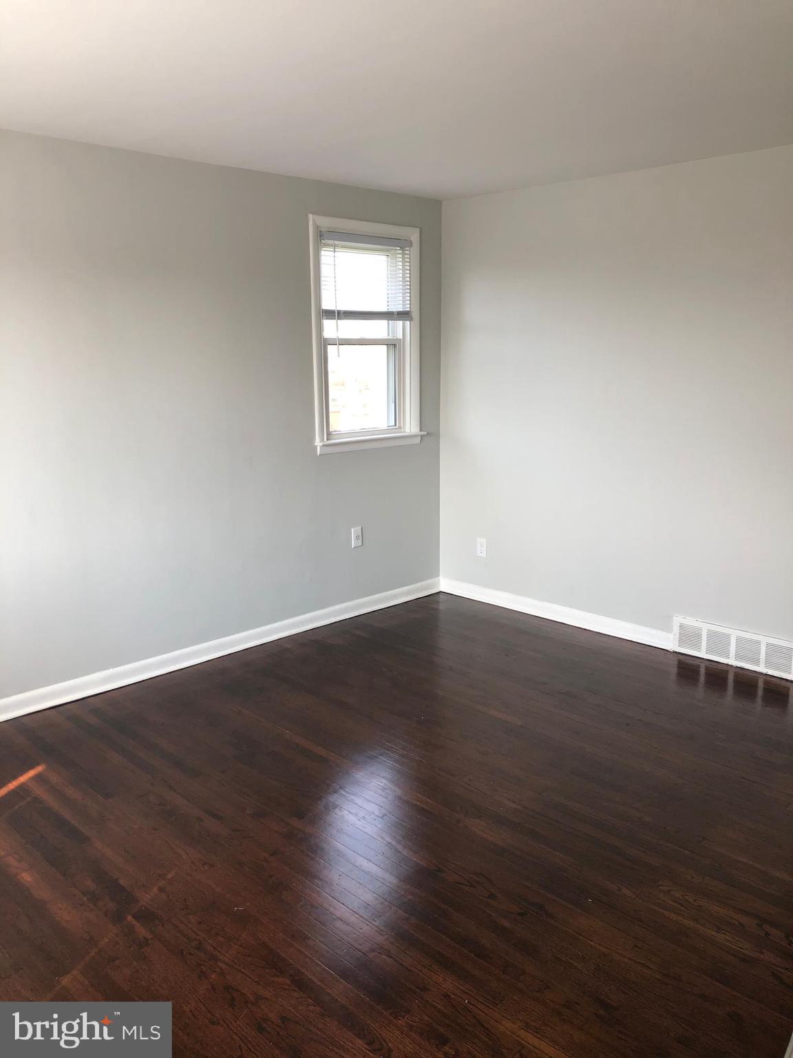 8726 Marsden Street Philadelphia, PA 19136 - Photo 19 of 24 a view of a room with wooden floor and window