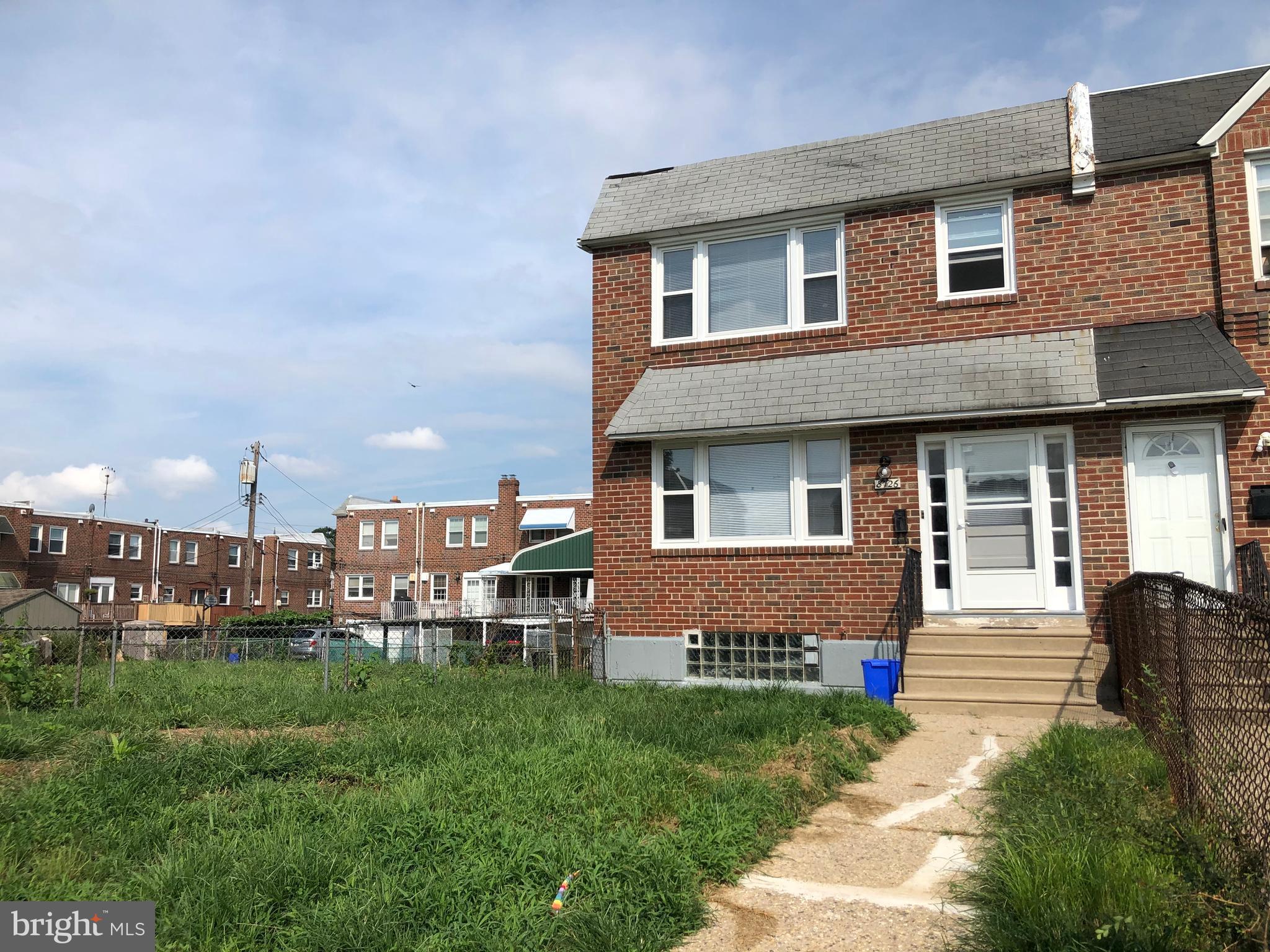 8726 Marsden Street Philadelphia, PA 19136 - Photo 2 of 24 a front view of a house with a yard table and chairs