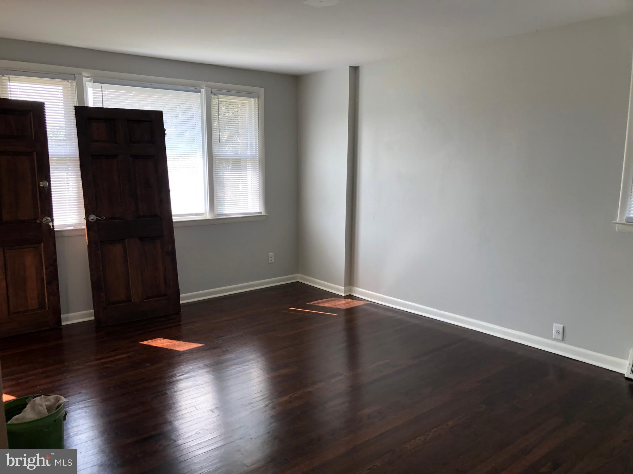 8726 Marsden Street Philadelphia, PA 19136 - Photo 6 of 24 an empty room with wooden floor and closet