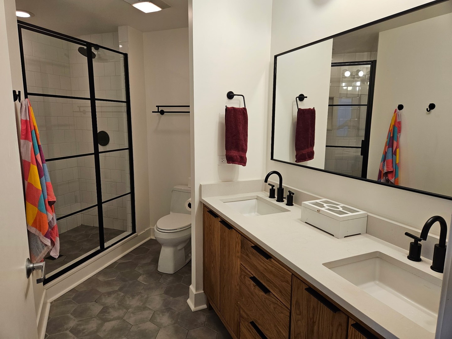 909 West Washington Boulevard, Unit 708 Chicago, IL 60607 - Photo 14 of 15 a bathroom with a double vanity sink toilet and mirror