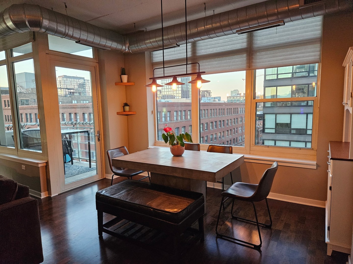 909 West Washington Boulevard, Unit 708 Chicago, IL 60607 - Photo 10 of 15 a dining room with furniture and wooden floor