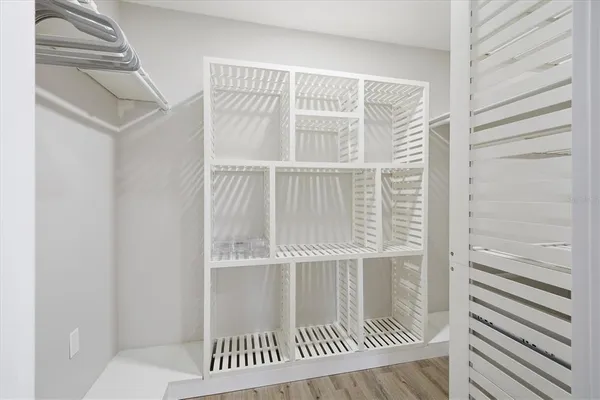 a spacious bathroom with a granite countertop sink and a mirror