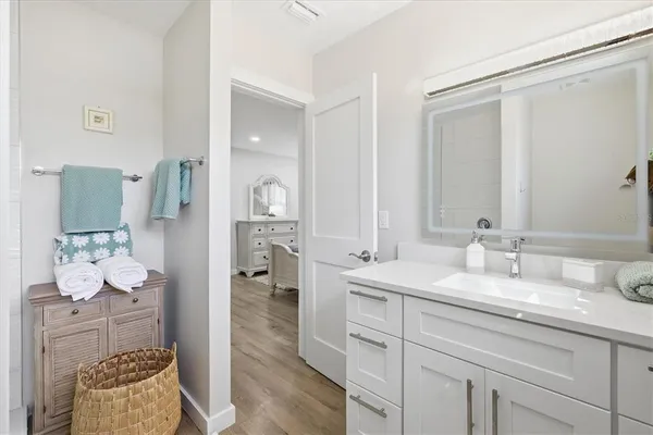 a bedroom with a bed and a ceiling fan