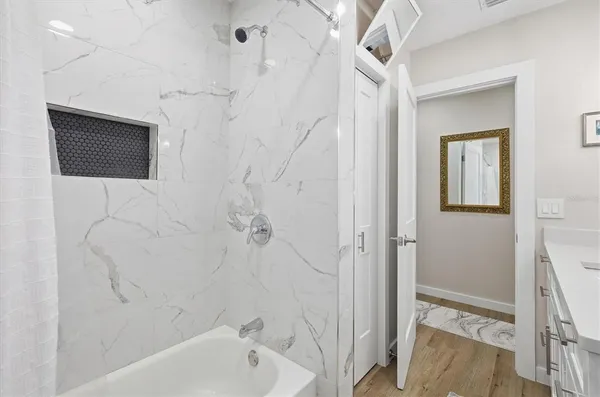 a view of a chairs and table in patio