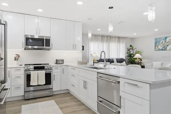 a kitchen with a sink and cabinets