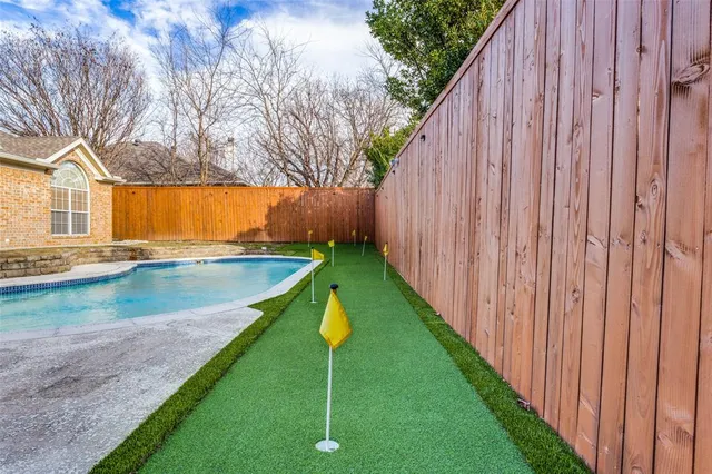 a view of a backyard with a small pool