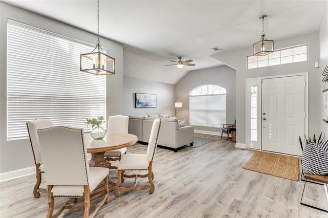 a view of a livingroom with furniture window and wooden floor
