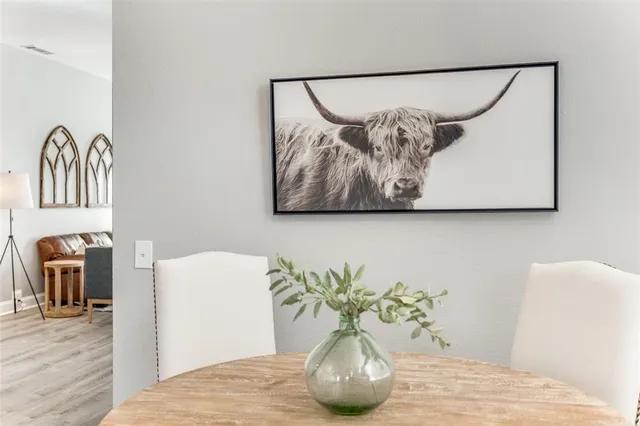 a view of a vase of flowers sitting on a table