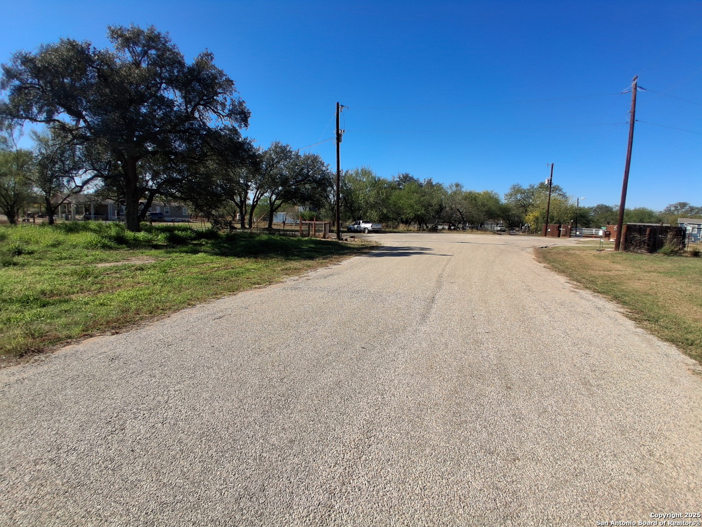 105 County Road 2671 Devine, TX 78016 - Photo 5 of 6 a view of a road with a yard