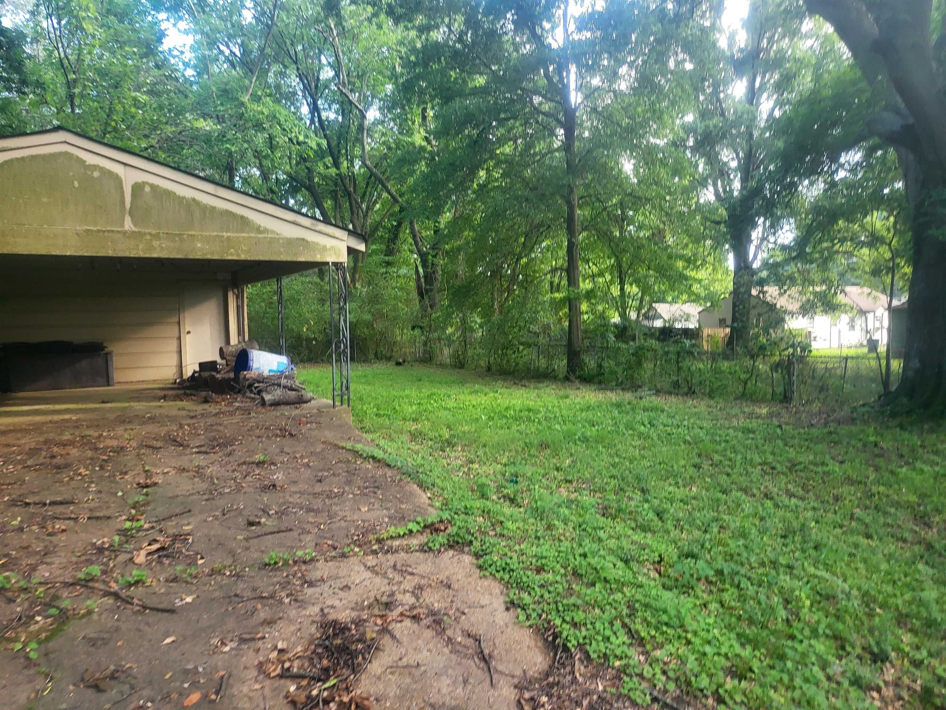 655 Granada Road Memphis, TN 38109 - Photo 4 of 5 a front view of a house with garden