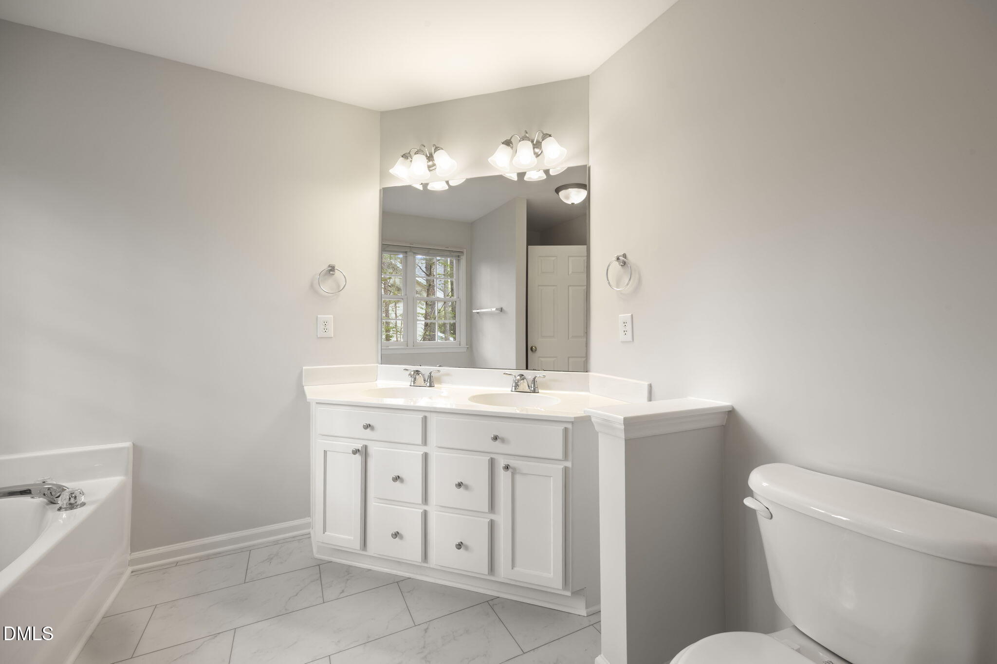 1008 Scotts Ridge Trail Apex, NC 27502 - Photo 33 of 57 a bathroom with a toilet sink and mirror