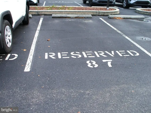 a view of street and parked cars