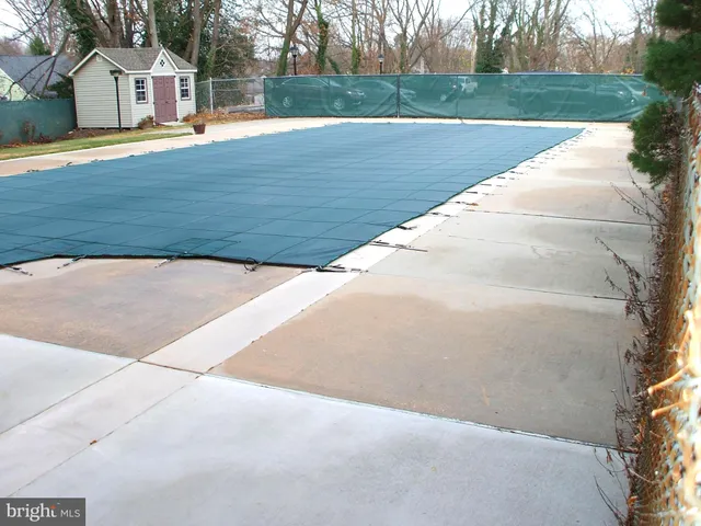 a living room with fireplace furniture and a potted plant
