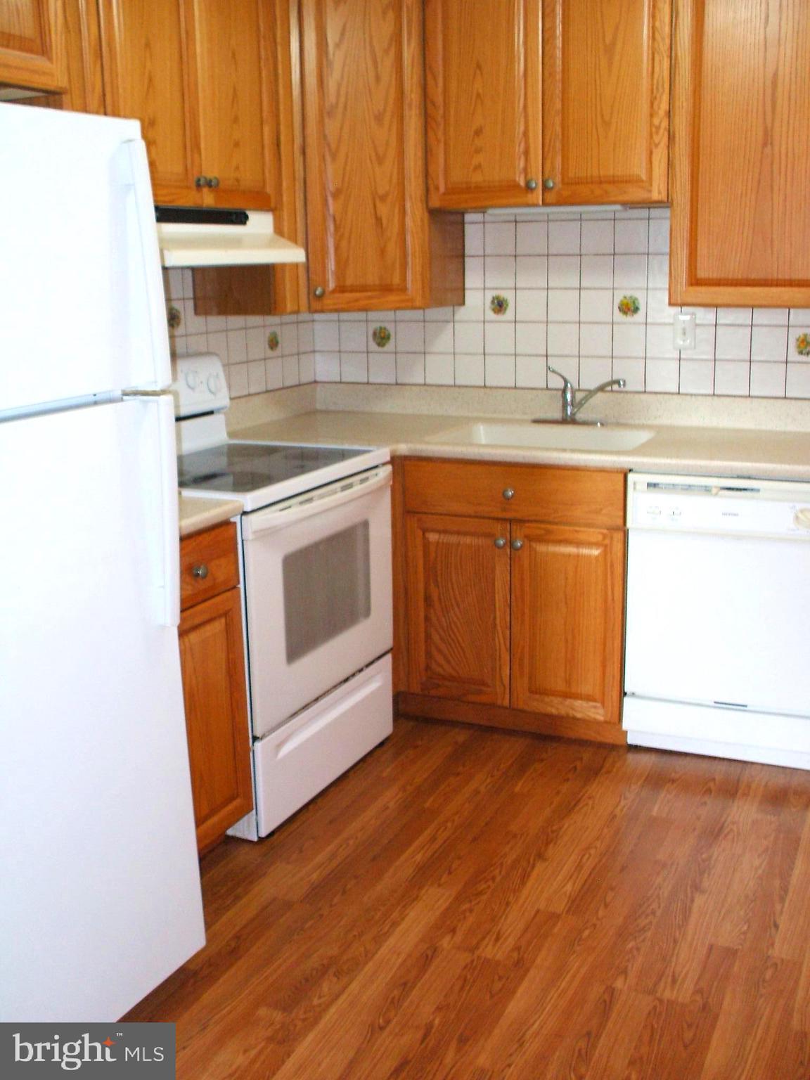 501 North Providence Road, Unit 221 Media, PA 19063 - Photo 8 of 29 Modern Kitchen W/Corian Counter & Tile Backsplash