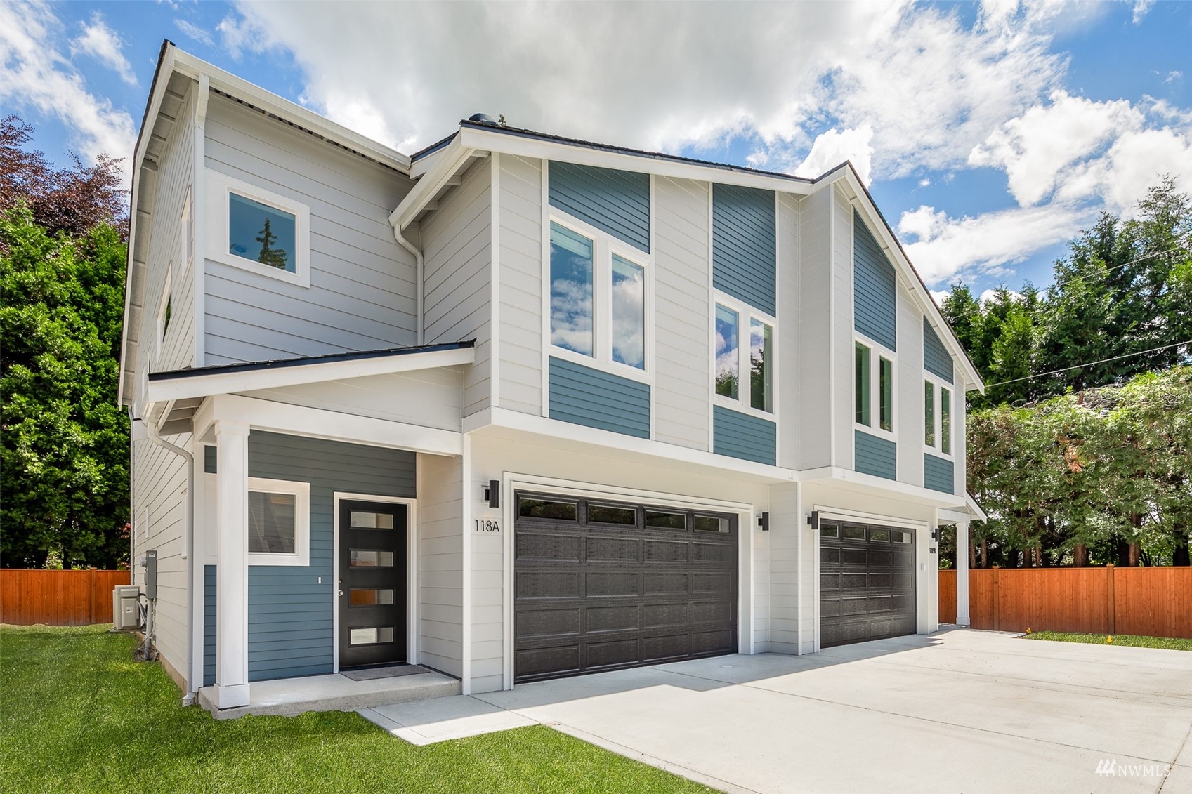 117 171st Place Southwest, Unit A Bothell, WA 98012 - Photo 1 of 20 a front view of a house with a yard and garage