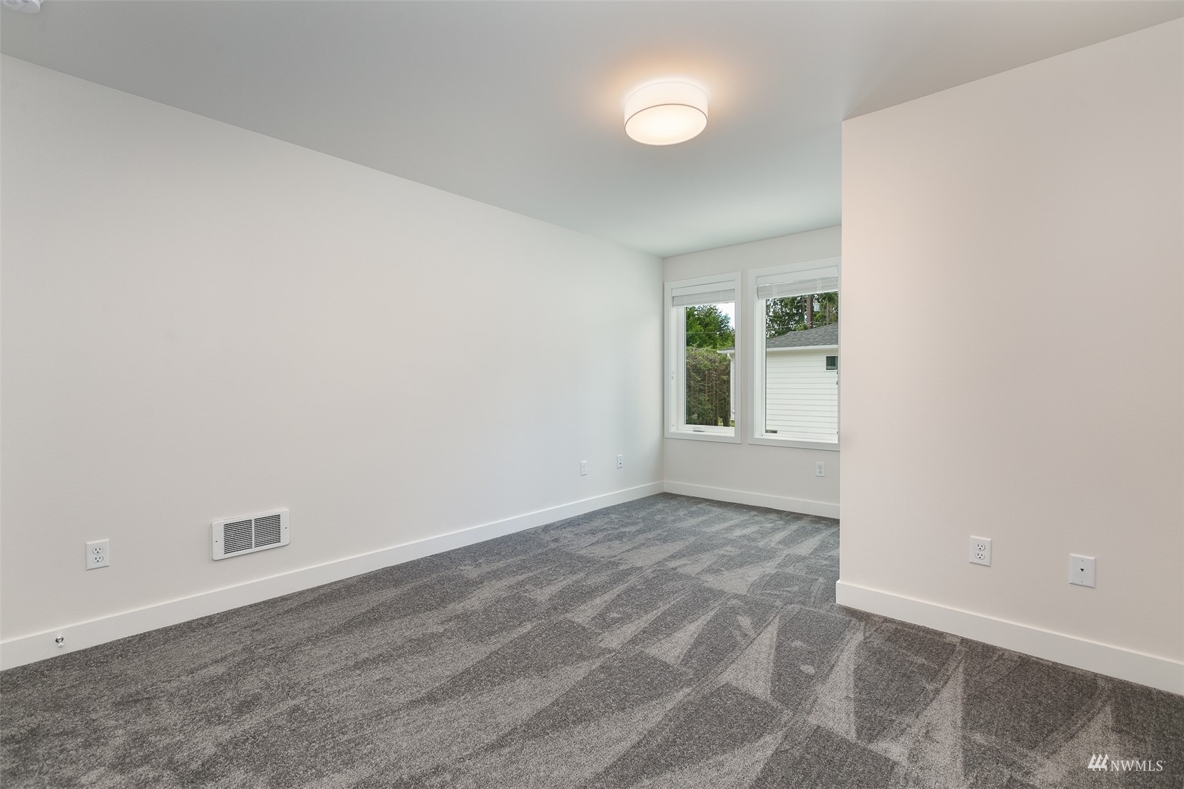 117 171st Place Southwest, Unit A Bothell, WA 98012 - Photo 16 of 20 an empty room with windows