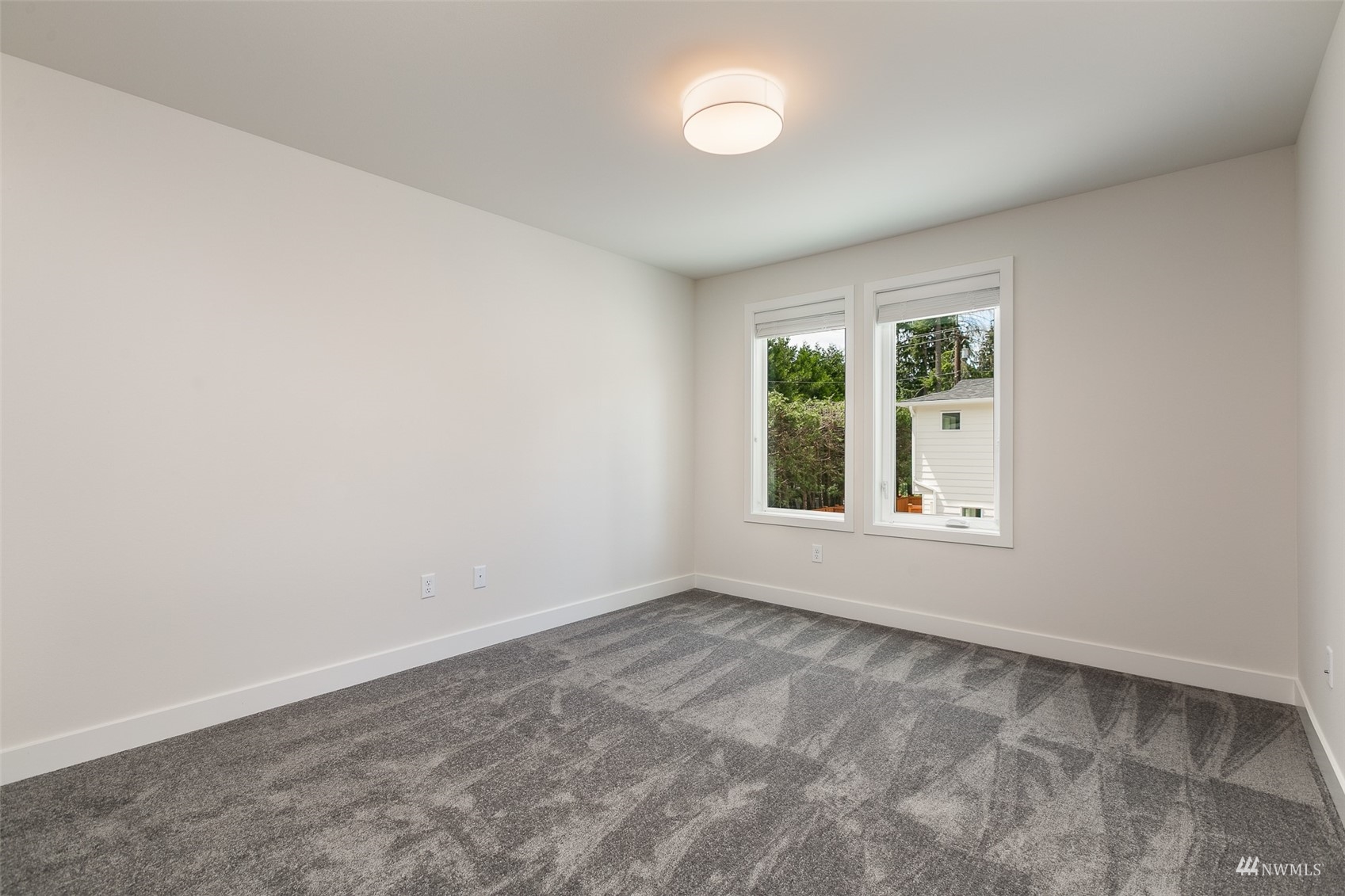 117 171st Place Southwest, Unit A Bothell, WA 98012 - Photo 18 of 20 an empty room with windows