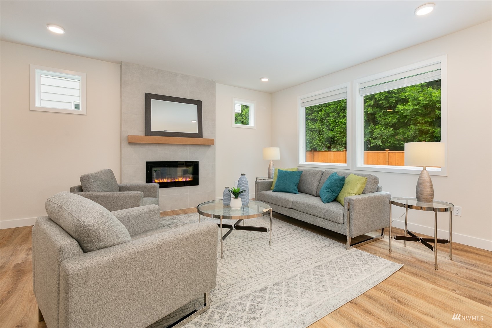 117 171st Place Southwest, Unit A Bothell, WA 98012 - Photo 4 of 20 a living room with furniture and a fireplace
