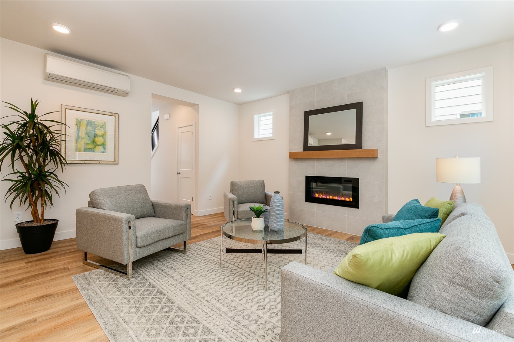 117 171st Place Southwest, Unit A Bothell, WA 98012 - Photo 5 of 20 a living room with furniture and a fireplace