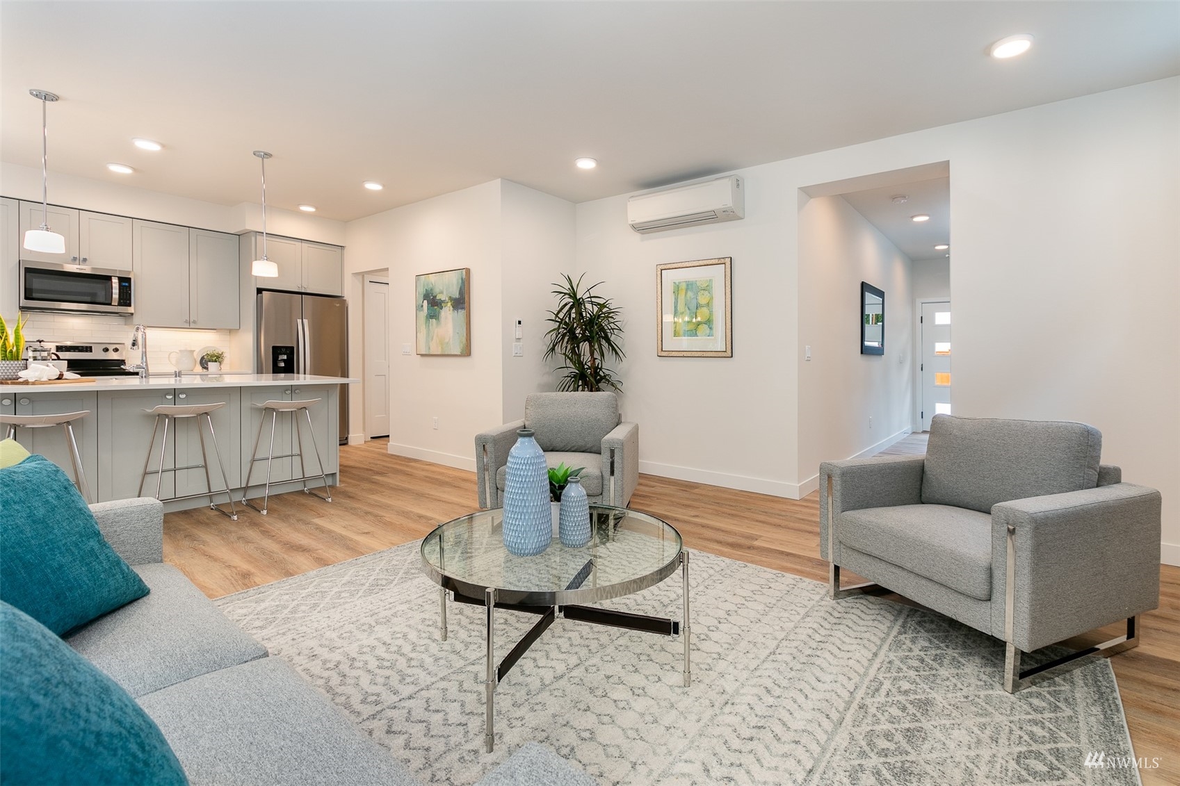 117 171st Place Southwest, Unit A Bothell, WA 98012 - Photo 6 of 20 a living room with furniture and a wooden floor