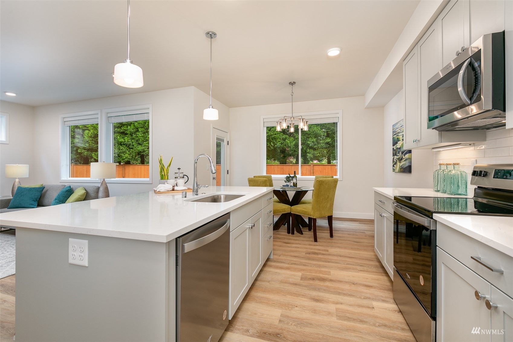 117 171st Place Southwest, Unit A Bothell, WA 98012 - Photo 9 of 20 a kitchen with sink a counter and chairs