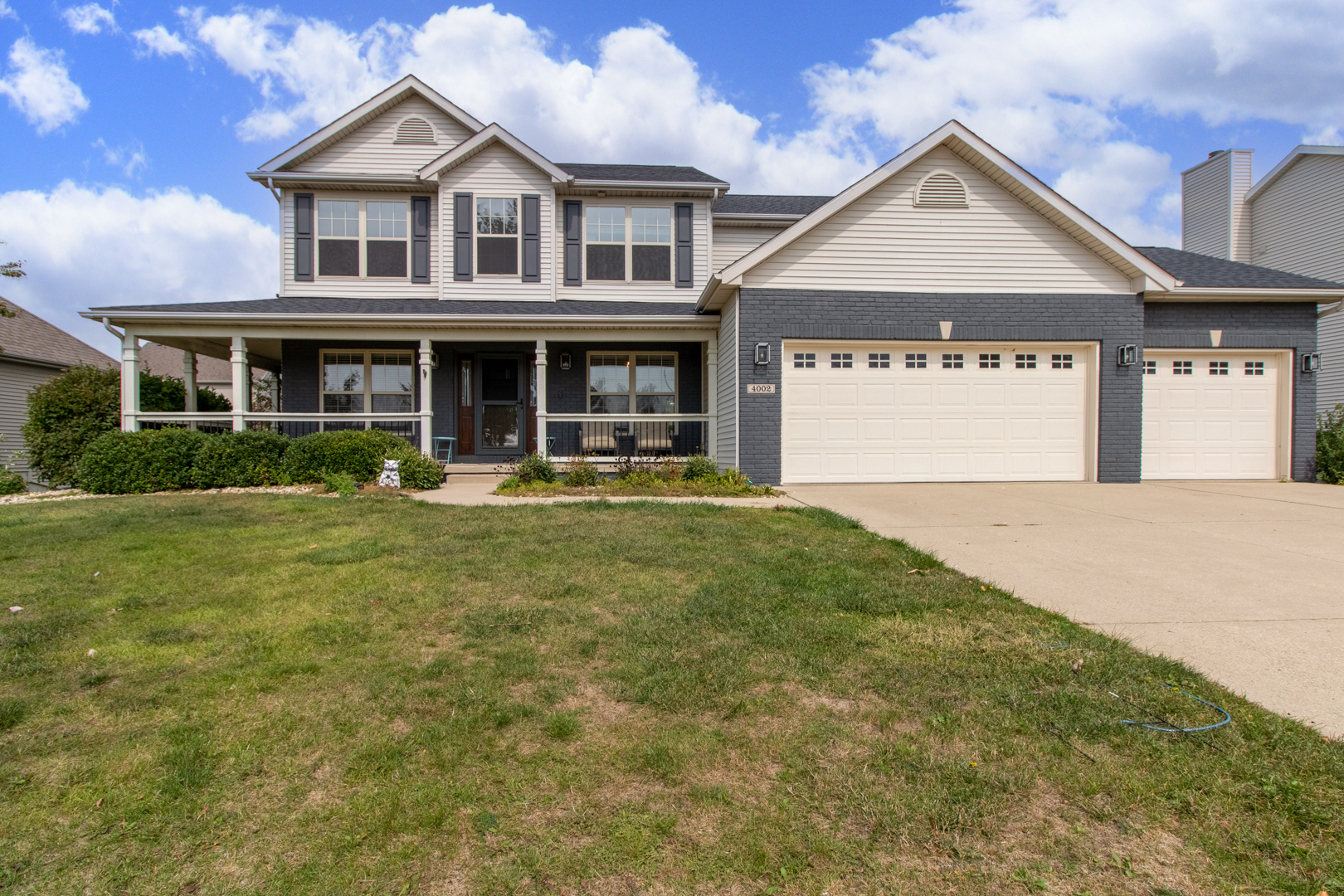 4002 Rockledge Road Bloomington, IL 61705 - Photo 1 of 60 a front view of a house with a yard