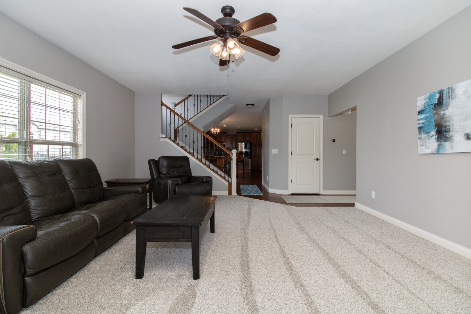 4002 Rockledge Road Bloomington, IL 61705 - Photo 15 of 60 a living room with furniture and a ceiling fan