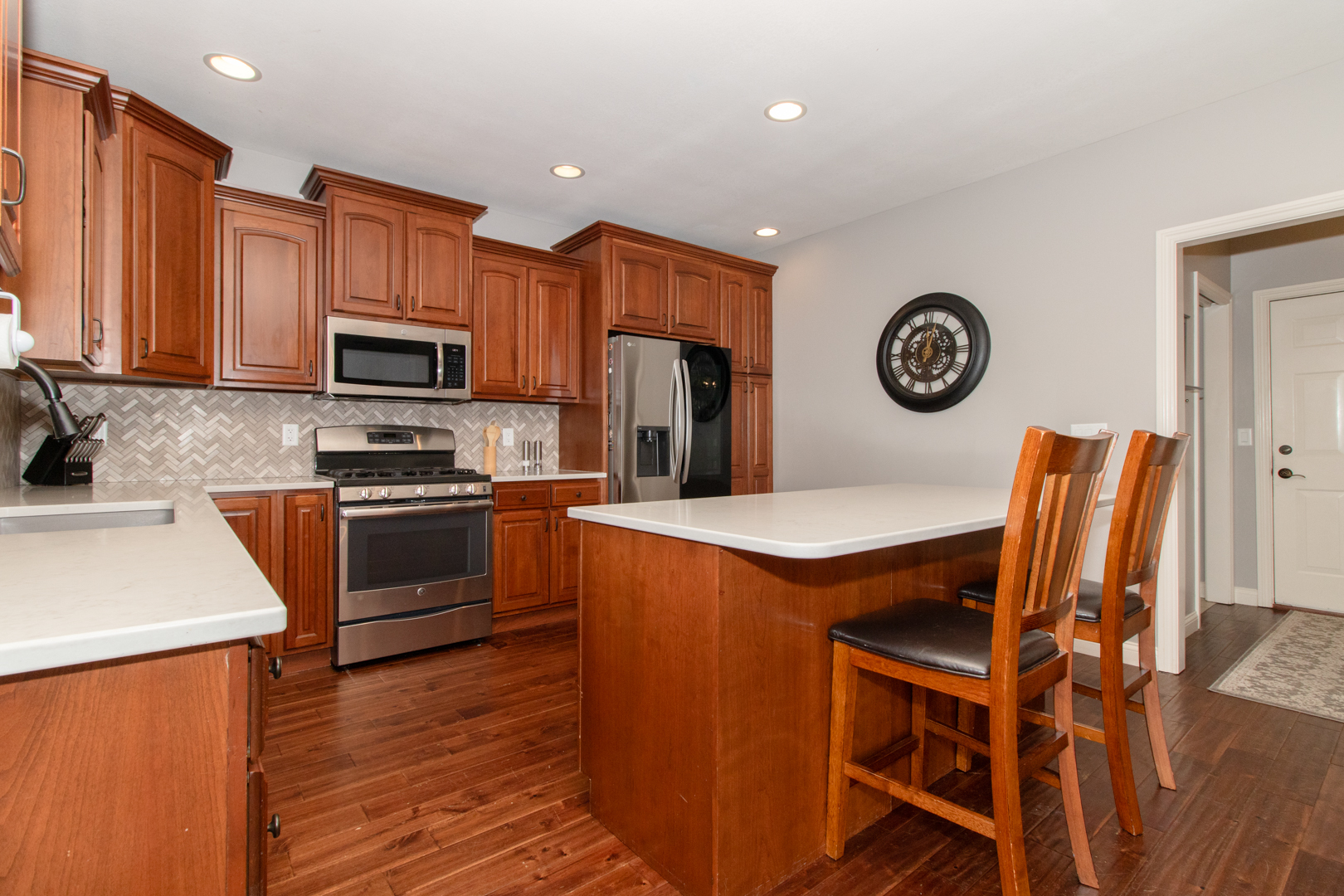 4002 Rockledge Road Bloomington, IL 61705 - Photo 19 of 60 a kitchen with a stove a refrigerator and a microwave