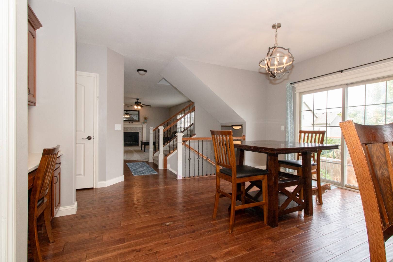 4002 Rockledge Road Bloomington, IL 61705 - Photo 22 of 60 a view of a dining room with furniture and wooden floor