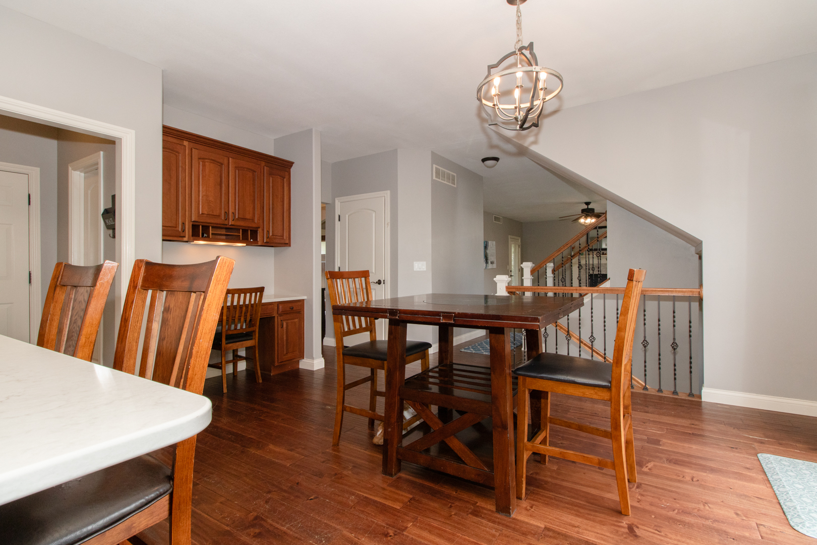 4002 Rockledge Road Bloomington, IL 61705 - Photo 24 of 60 a view of a dining room with furniture and wooden floor