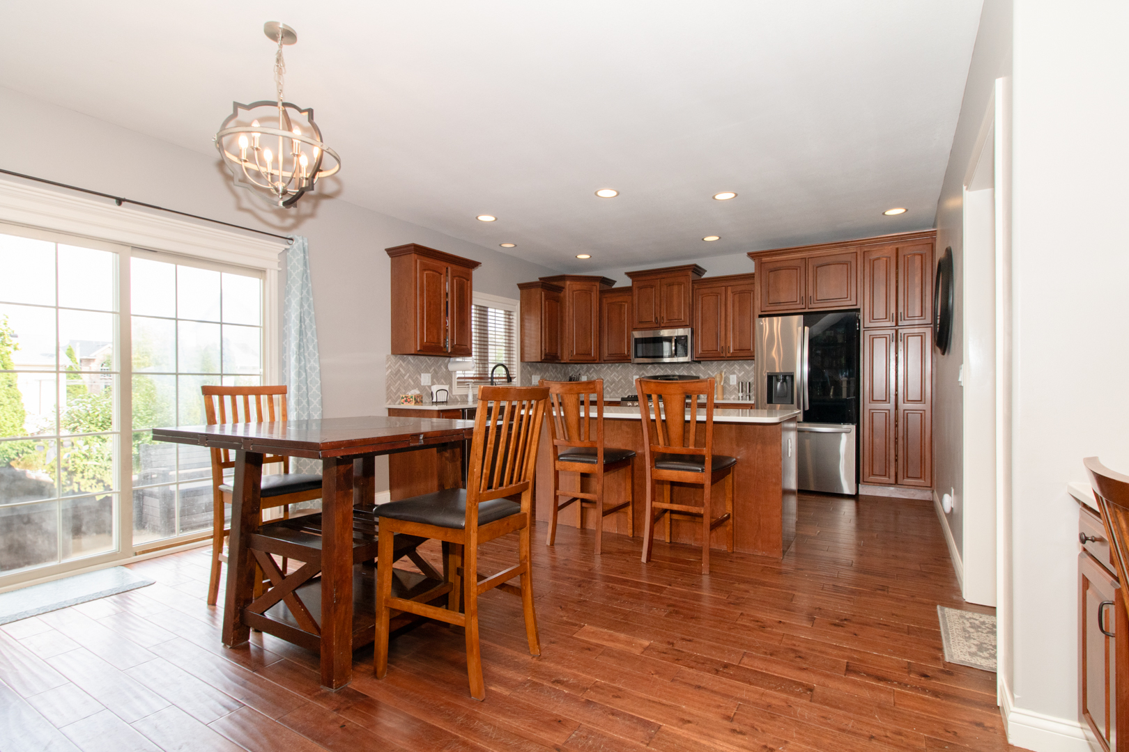 4002 Rockledge Road Bloomington, IL 61705 - Photo 26 of 60 a view of a dining room with furniture window and wooden floor