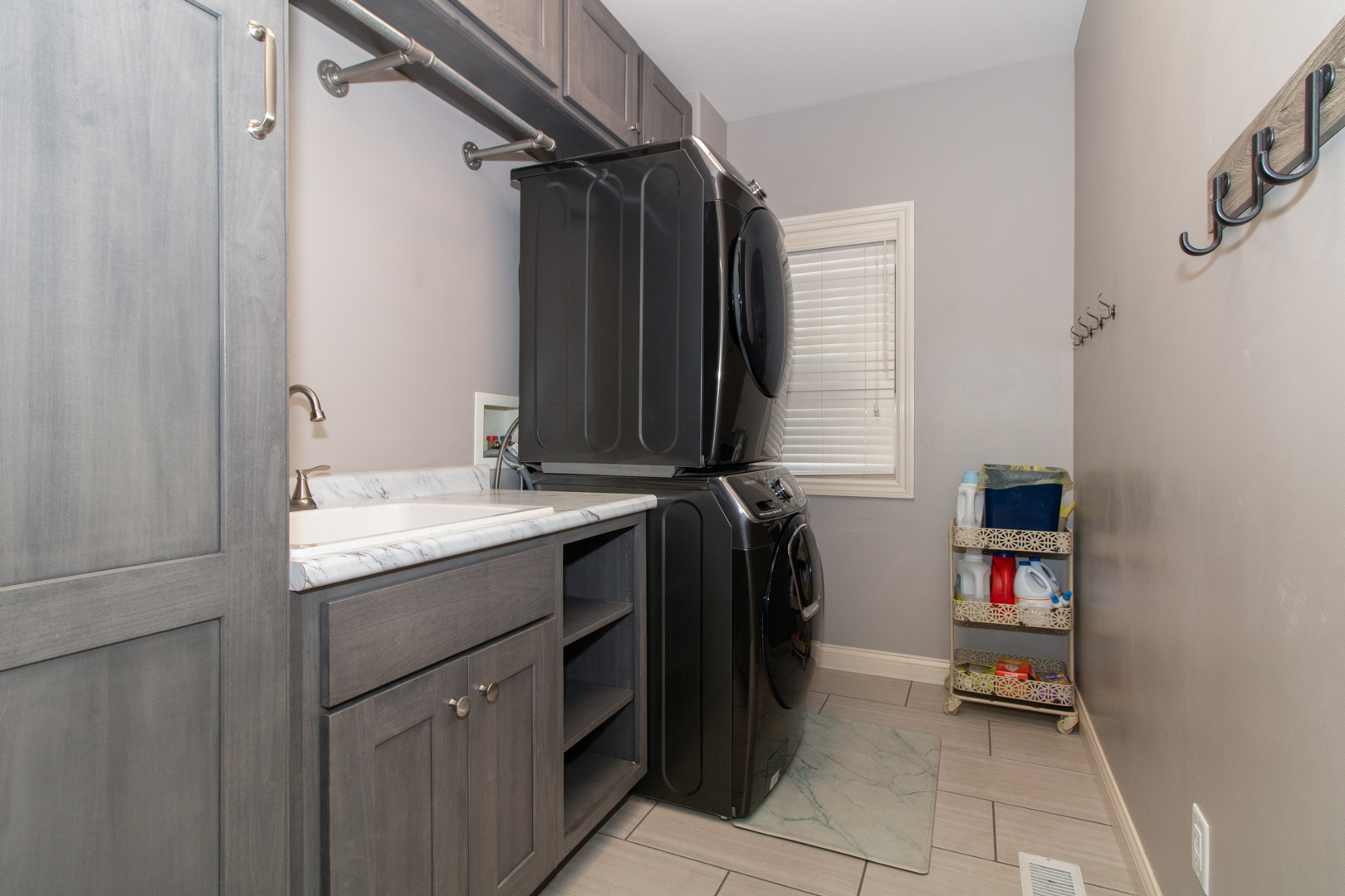 4002 Rockledge Road Bloomington, IL 61705 - Photo 27 of 60 a bathroom with a granite countertop sink and a mirror