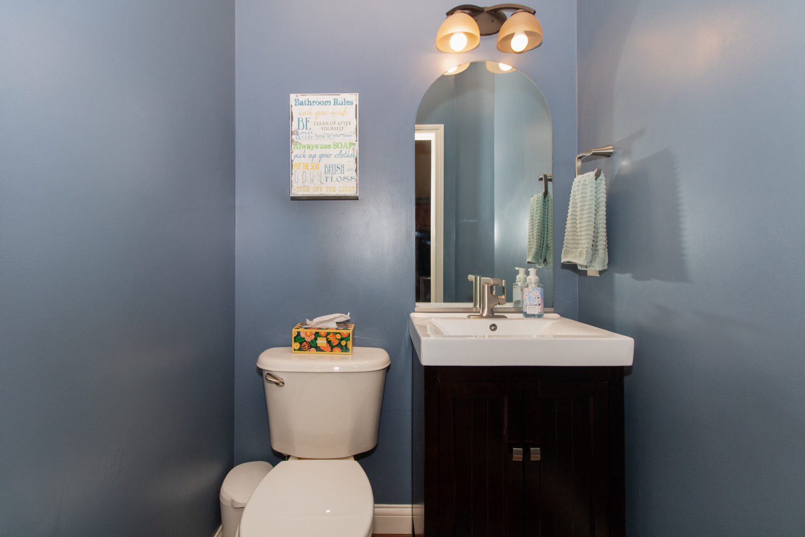 4002 Rockledge Road Bloomington, IL 61705 - Photo 29 of 60 a bathroom with a toilet sink and mirror