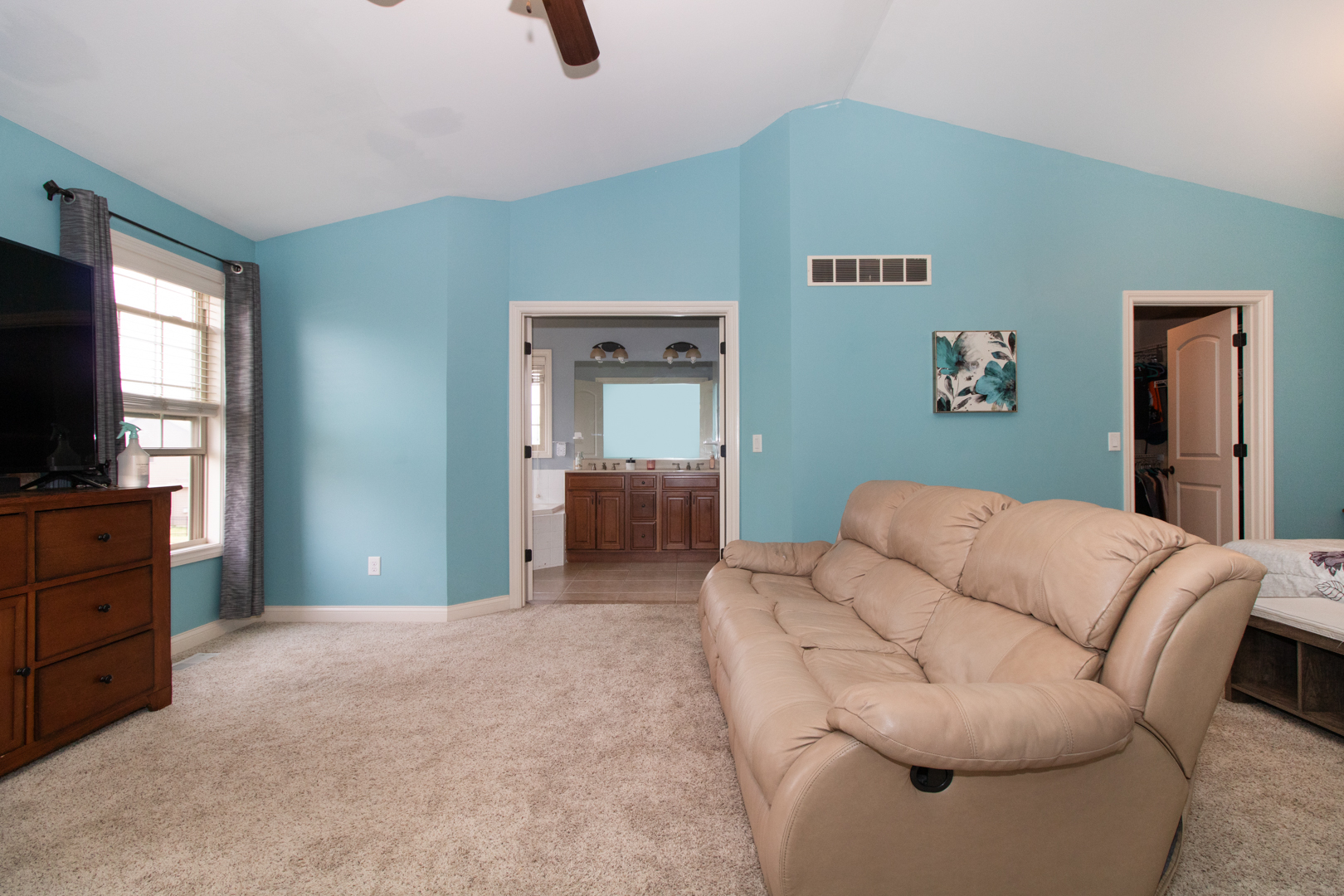 4002 Rockledge Road Bloomington, IL 61705 - Photo 30 of 60 a bedroom with furniture and a flat screen tv