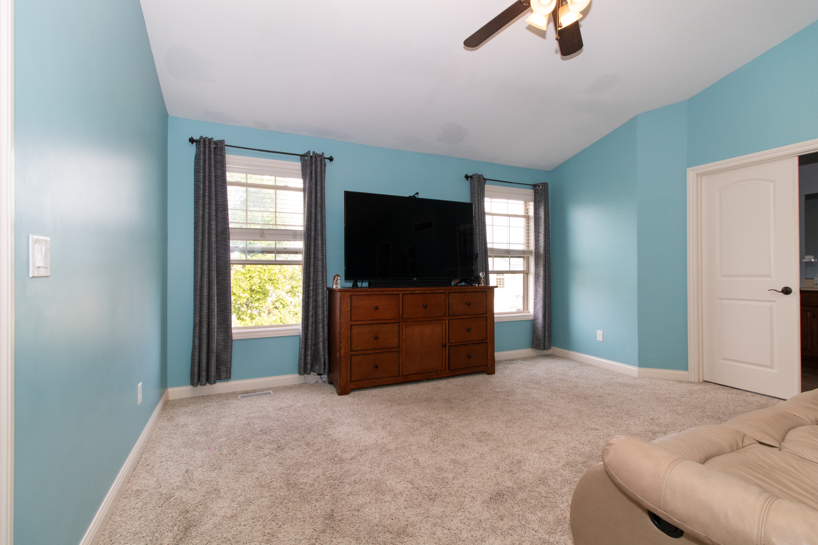 4002 Rockledge Road Bloomington, IL 61705 - Photo 34 of 60 a bedroom with furniture and a flat screen tv